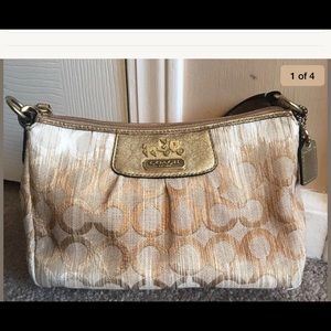 Coach signature small gold handbag w/pink interior